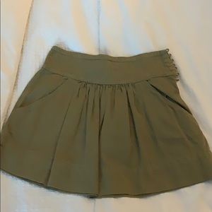 Green pleated skirt